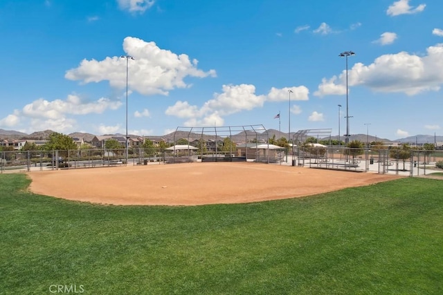 surrounding community with a yard and fence