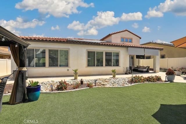 back of house with a patio, stucco siding, fence, and an outdoor hangout area