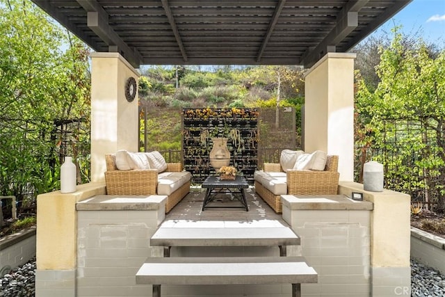 view of patio / terrace with fence and an outdoor living space