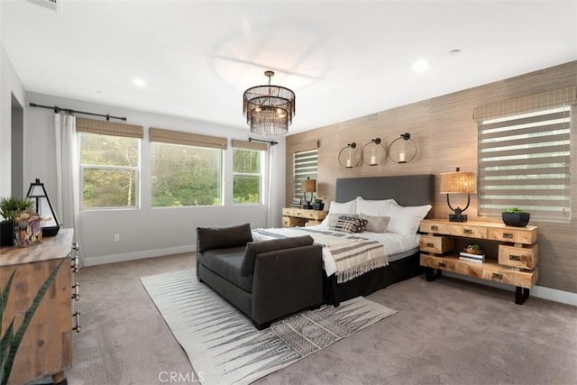 carpeted bedroom with recessed lighting, visible vents, an inviting chandelier, an accent wall, and baseboards