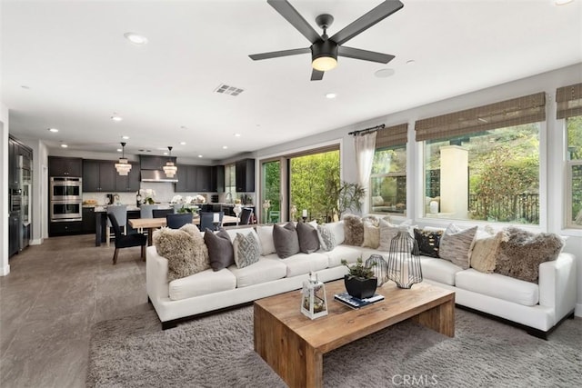 living area featuring recessed lighting, visible vents, and ceiling fan