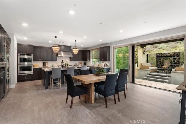 dining area featuring recessed lighting