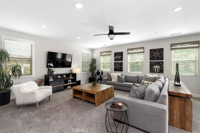 living room featuring carpet, plenty of natural light, visible vents, and recessed lighting