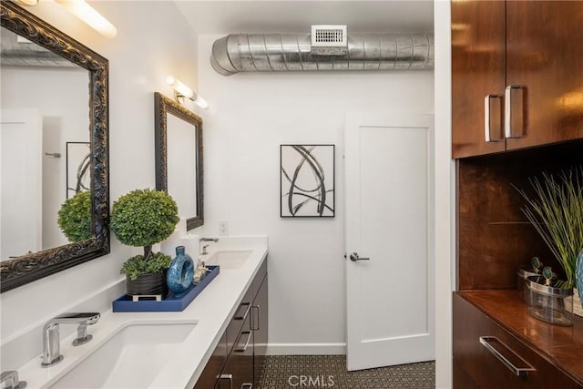 660 N Sweetzer Ave Unit 302, West Hollywood, CA 90048 - bathroom with double vanity and baseboards
