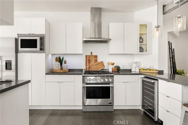 660 N Sweetzer Ave Unit 302, West Hollywood, CA 90048 - kitchen featuring wall chimney exhaust hood, high end range, built in microwave, wine cooler, and dark countertops