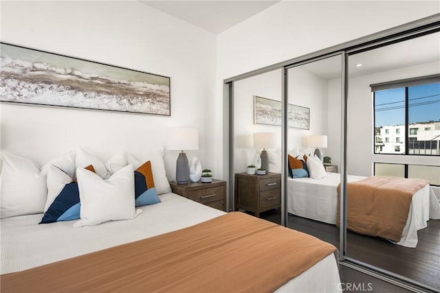 bedroom featuring a closet and wood finished floors