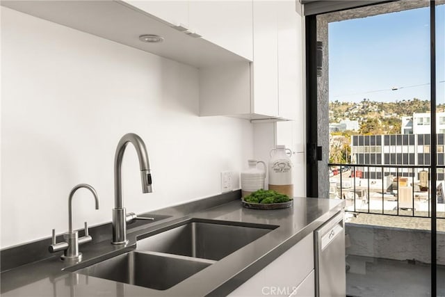660 N Sweetzer Ave Unit 302, West Hollywood, CA 90048 - kitchen with white cabinets, dark countertops, modern cabinets, dishwasher, and plenty of natural light