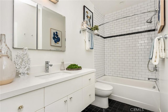 full bathroom with tile patterned floors, toilet, vanity, and shower / tub combination