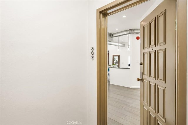 hallway with wood finished floors