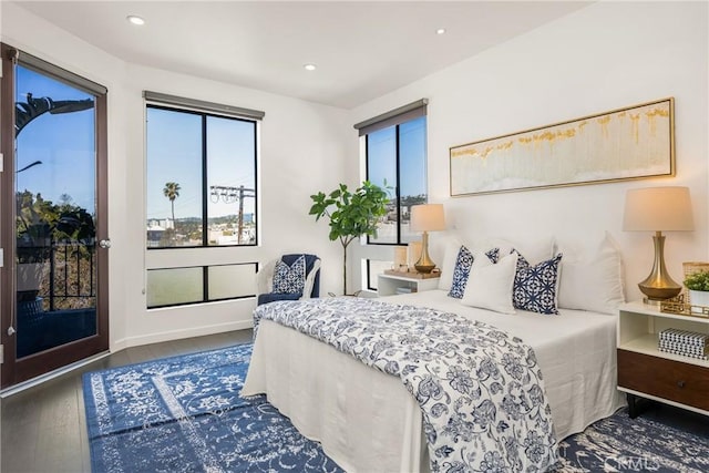 bedroom with access to exterior, recessed lighting, baseboards, and wood finished floors