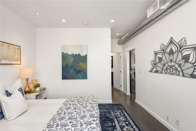 bedroom with dark wood finished floors, visible vents, recessed lighting, and baseboards