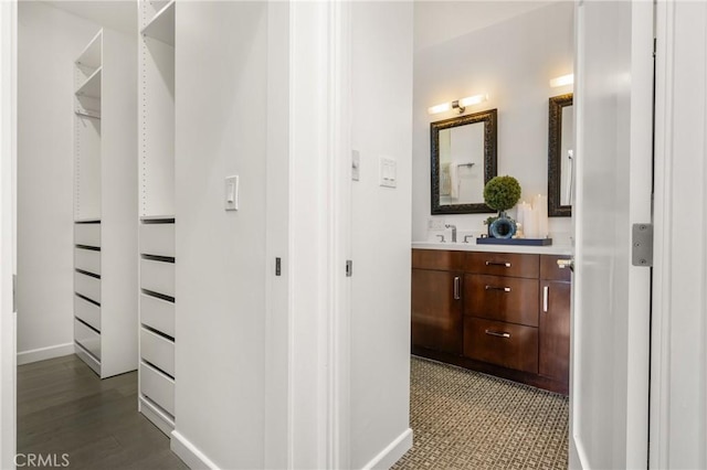 bathroom with vanity and baseboards