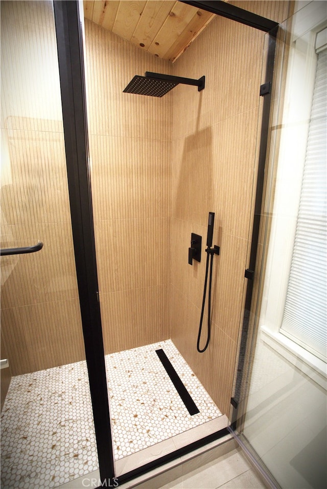 full bath with a shower stall