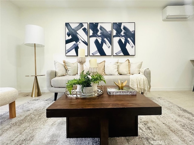 2521 W Sunflower Ave Unit D4, Santa Ana, CA 92704 - living area featuring a wall mounted air conditioner, baseboards, and wood finished floors
