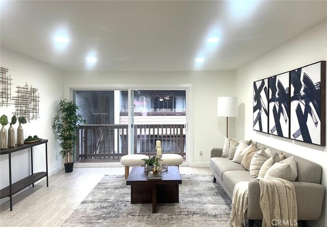 living area featuring wood finished floors and baseboards