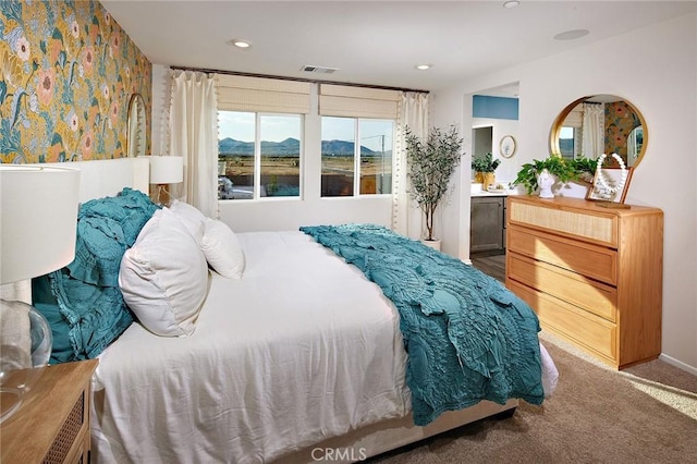 bedroom featuring carpet, visible vents, a mountain view, and recessed lighting