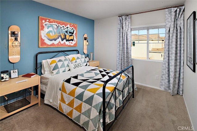 bedroom featuring carpet and baseboards