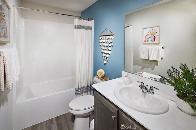 bathroom featuring vanity, shower / bath combo, wood finished floors, and toilet