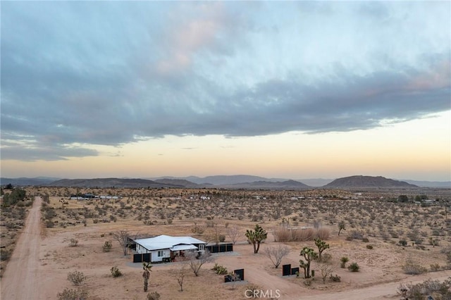 view of mountain feature with a desert view and a rural view