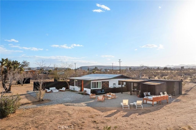 56622 Handley Rd, Yucca Valley, CA 92284 - rear view of house with a patio area and a sunroom