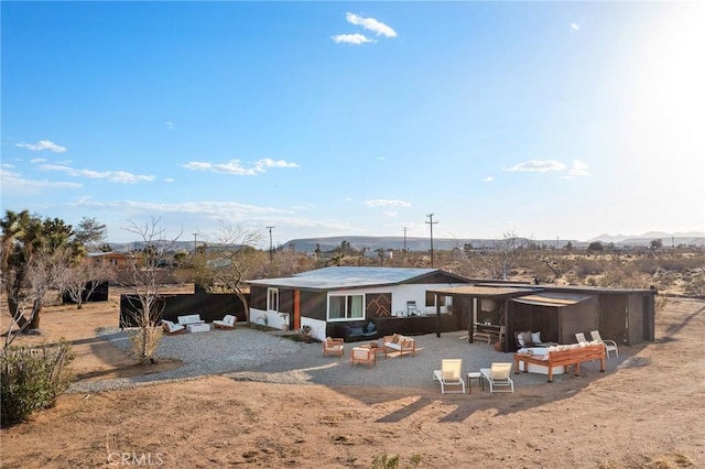 56622 Handley Rd, Yucca Valley, CA 92284 - rear view of property with a patio and a sunroom