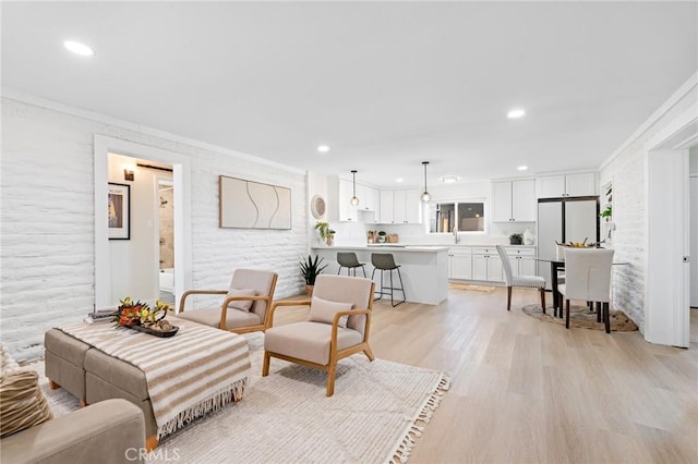 56622 Handley Rd, Yucca Valley, CA 92284 - living room with ornamental molding, light wood-type flooring, and recessed lighting