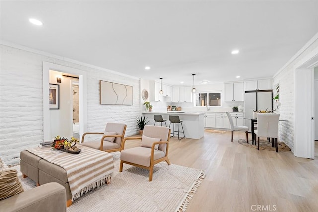 56622 Handley Rd, Yucca Valley, CA 92284 - living area featuring crown molding, light wood-style floors, and recessed lighting