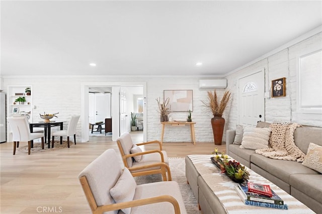 living area with light wood-style floors, recessed lighting, an AC wall unit, and ornamental molding