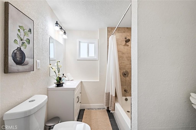 full bath featuring shower / bath combination with curtain, a textured wall, toilet, a textured ceiling, and vanity