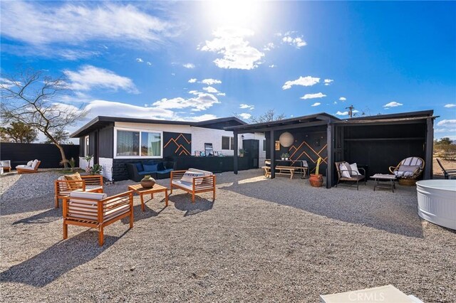 56622 Handley Rd, Yucca Valley, CA 92284 - rear view of house with an outdoor hangout area and a patio area