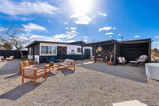 56622 Handley Rd, Yucca Valley, CA 92284 - back of property with an outdoor hangout area and a patio area