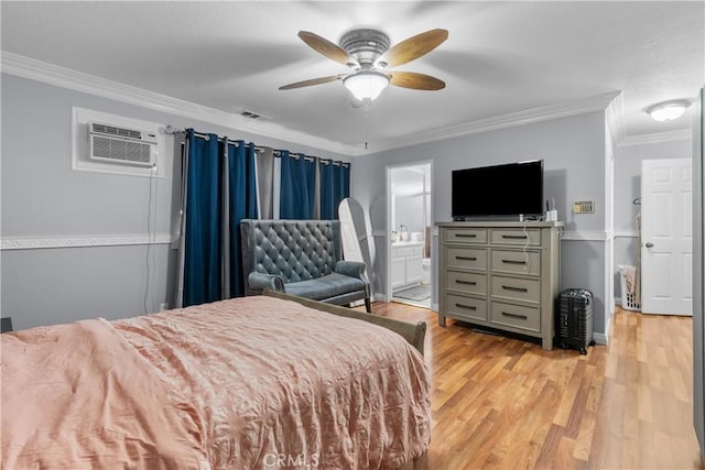 bedroom with a wall unit AC, light wood finished floors, visible vents, ornamental molding, and a ceiling fan