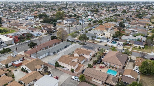 birds eye view of property with a residential view