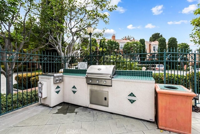 view of patio / terrace with fence, grilling area, and area for grilling