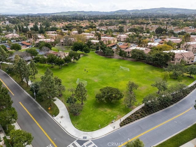 drone / aerial view featuring a residential view and a mountain view