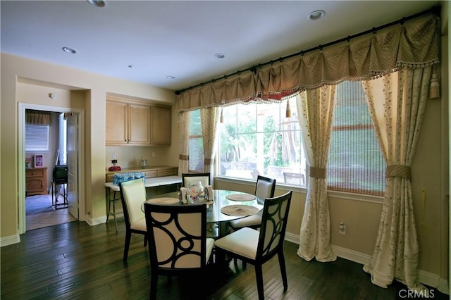 dining area with recessed lighting, dark wood finished floors, and baseboards