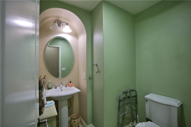 bathroom with a sink and toilet