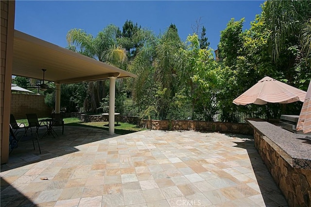 view of patio with fence and outdoor dining area