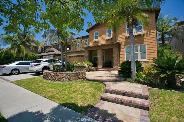 view of front of property featuring a front yard and driveway