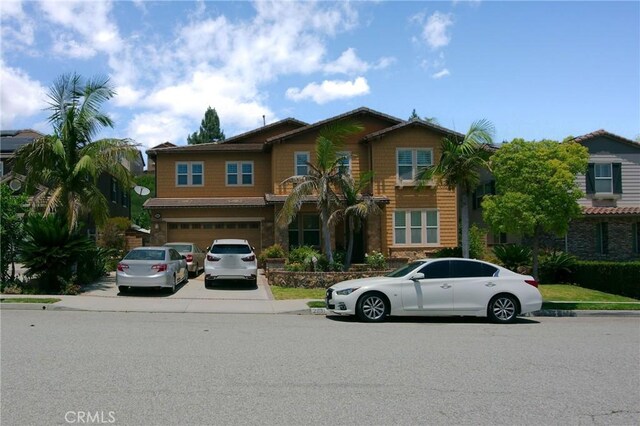 view of front of home with driveway and an attached garage