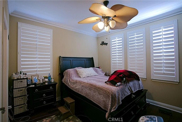 bedroom featuring ornamental molding and ceiling fan