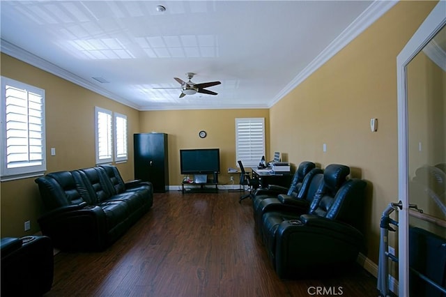 living area featuring baseboards, ceiling fan, ornamental molding, and wood finished floors