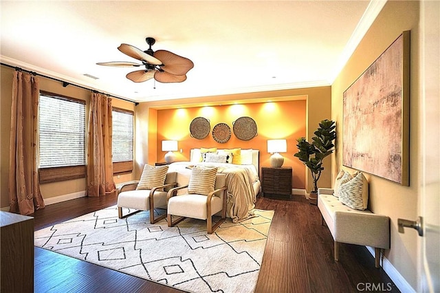 bedroom with baseboards, crown molding, ceiling fan, and wood-type flooring