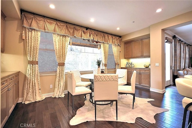 dining space with baseboards, recessed lighting, and dark wood-style flooring