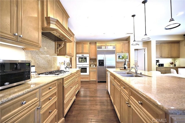 kitchen with custom range hood, backsplash, a sink, dark wood-style floors, and built in appliances