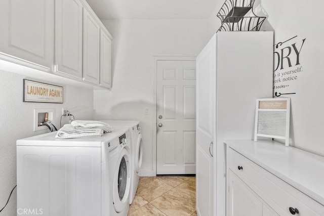 laundry room featuring cabinet space, independent washer and dryer, and light tile patterned flooring