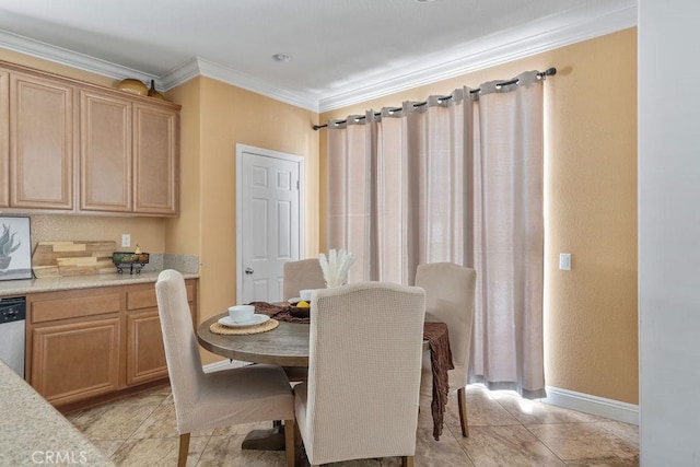 dining room with light tile patterned flooring and crown molding