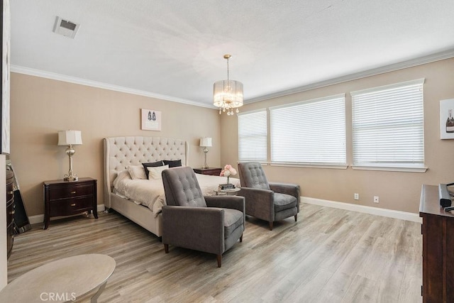 bedroom featuring visible vents, light wood-type flooring, baseboards, and ornamental molding