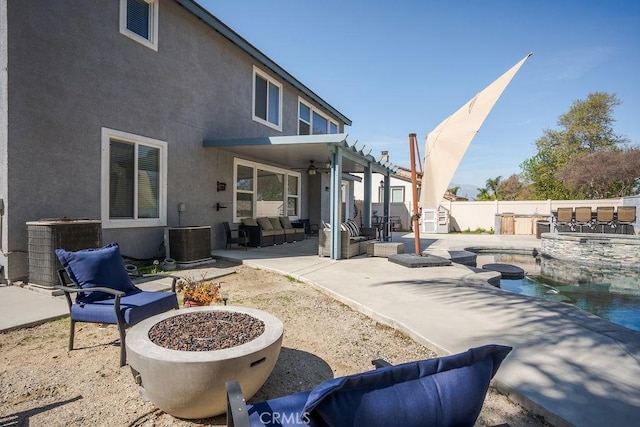 view of patio / terrace featuring central air condition unit, a fenced in pool, a fenced backyard, and an outdoor fire pit