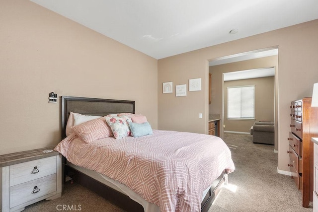 bedroom featuring baseboards and carpet floors